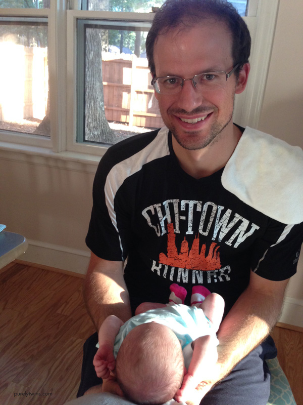 new-dad-holding-first-baby-girl-at-home