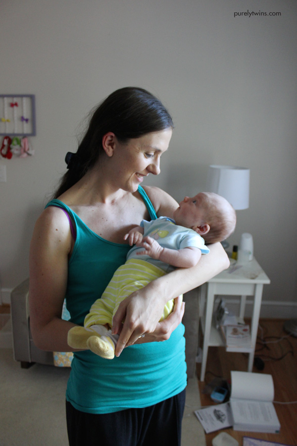 new-mom-holding-baby-girl-one-month