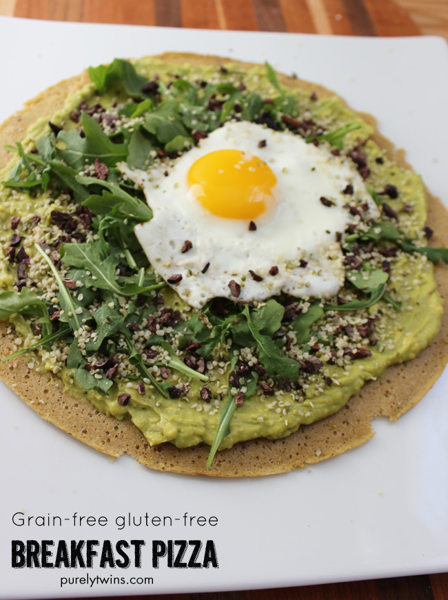 Gluten-free, grain-free breakfast pizza that will fuel you for your busy day ahead. Quick and healthy breakfast pizza. Made from real foods. A warm crust topped with creamy avocado cream, topped with spicy peppery-mustardy arugula, savory hemp seeds, runny egg and cacao nibs for fun.