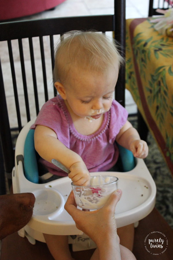 one year old eating coconut yogurt by herself. Baby led weaning. \\ www.purelytwins.com