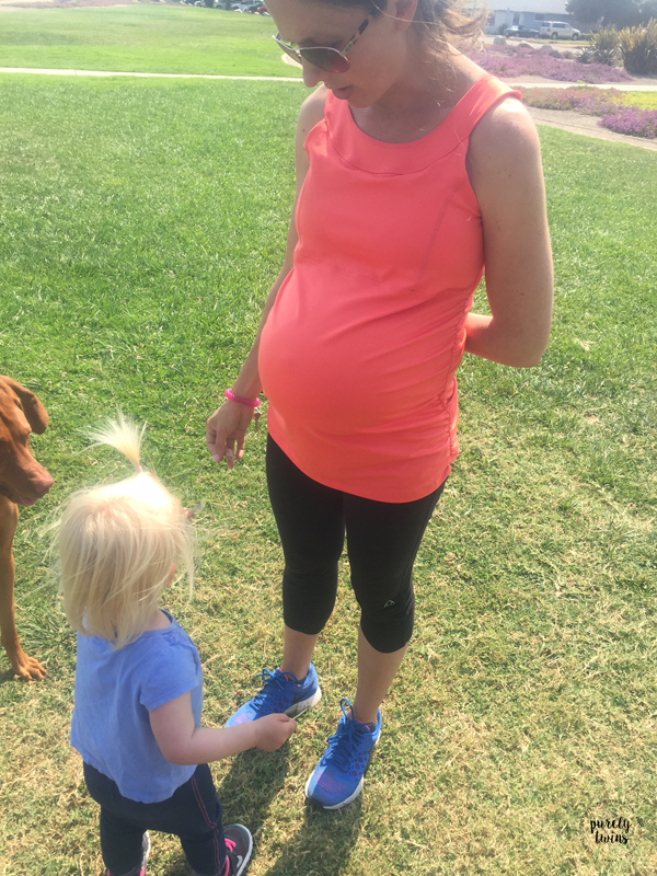 35 weeks pregnant with second child and playing with first child at the park