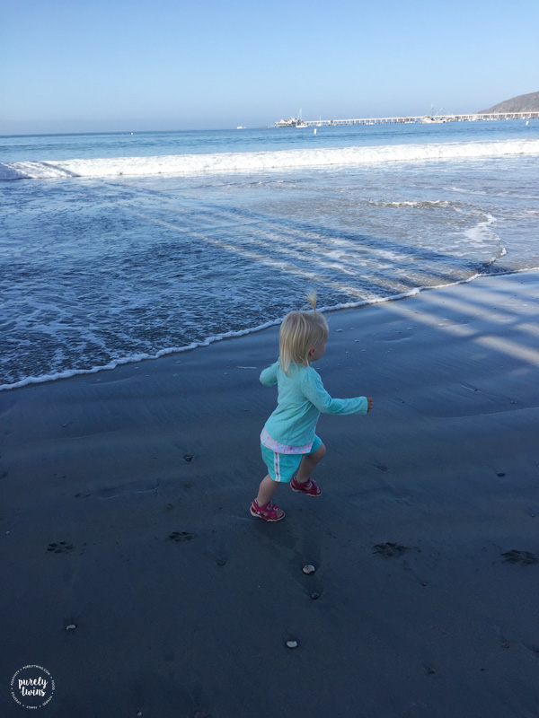 Toddler running on the beach