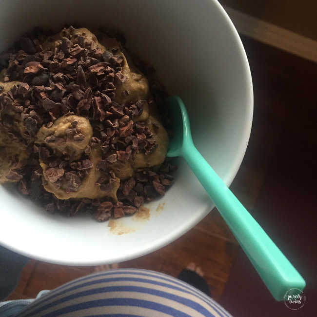 38 week baby bump action while eating breakfast of a high fat high protein avocado protein mush with cacao nibs.