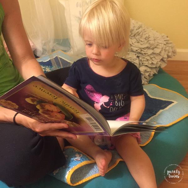 Reading tinkerbell story to toddler before bed.