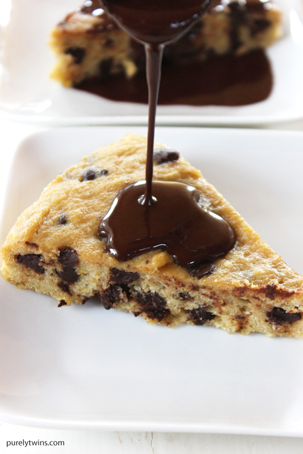 Gluten-free grain-free flourless plantain chocolate chip cookie with homemade hot fudge sauce. The best way to eat a chocolate chip cookie. As cake drenched in chocolate sauce. Right? Ultra soft, chewy and delicious, this is the best cookie cake you will ever make. Complete with rich dairy-free chocolate sauce. 