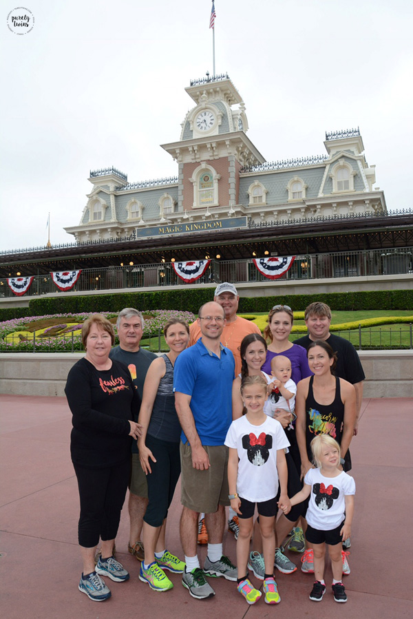 Family photo outside Magic Kingdom. Disney photo pass. Disney family vacation.